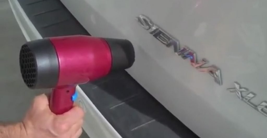 Debadging a car with hairdryer